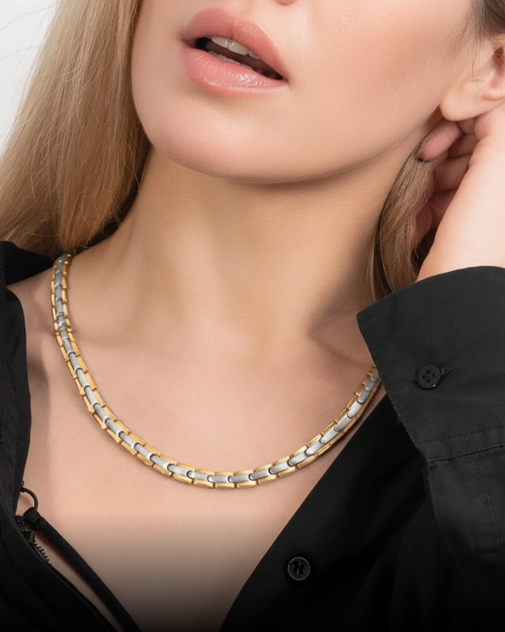 Titanium magnetic therapy necklace in silver and gold, close-up detail